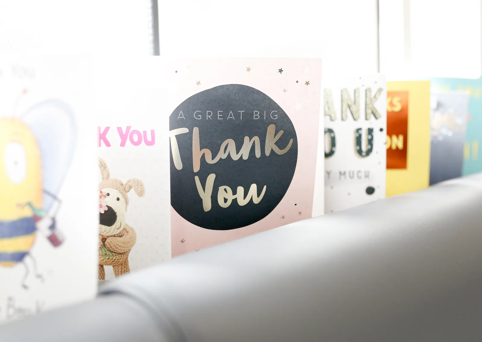 A row of thank-you cards from real patients displayed in the Forest Dental waiting room